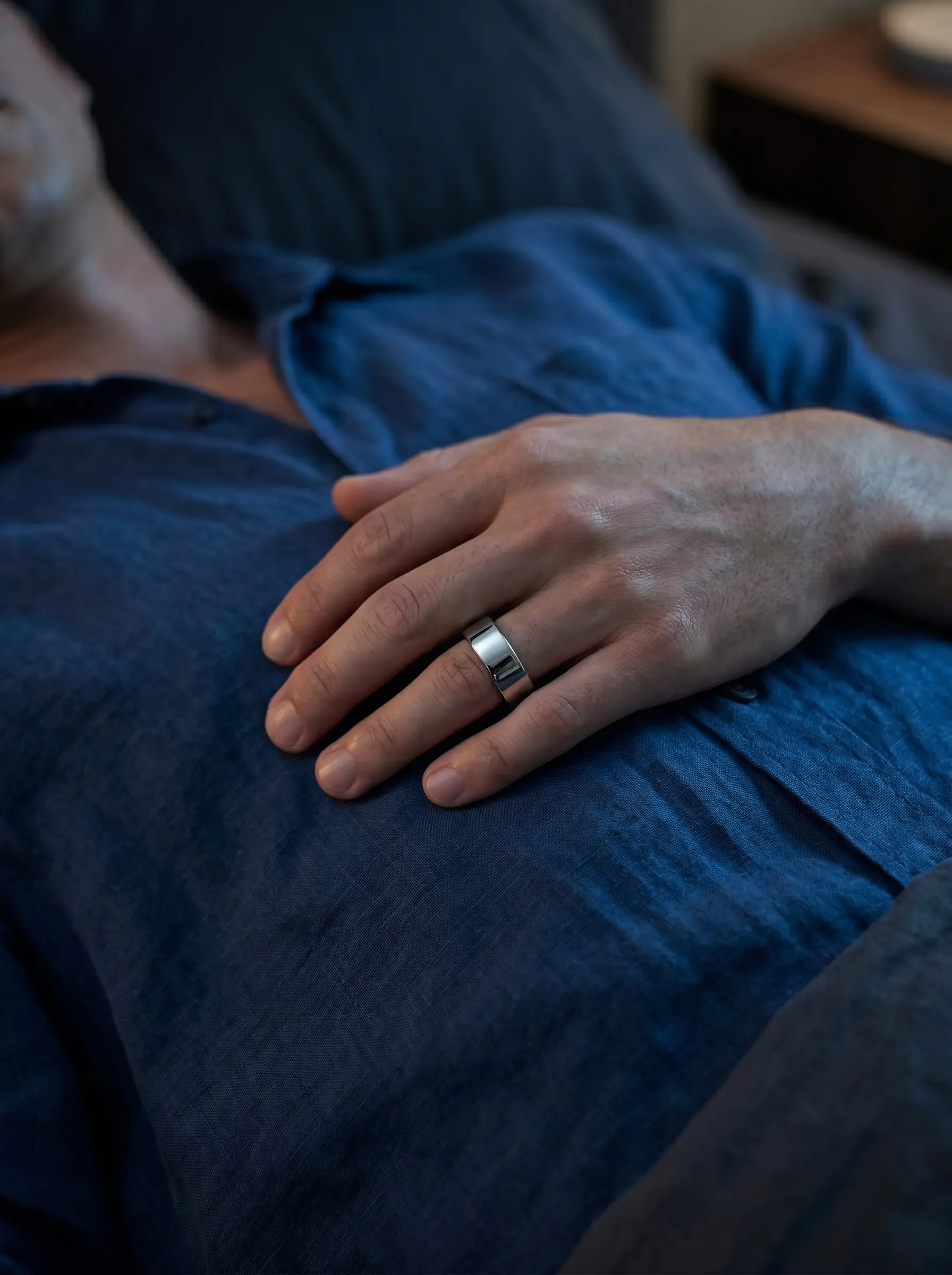 Person resting wearing XONYL smart ring
